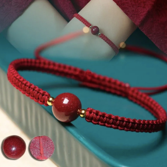 ARMBAND - RODE DRAAD VAN HET LOT
