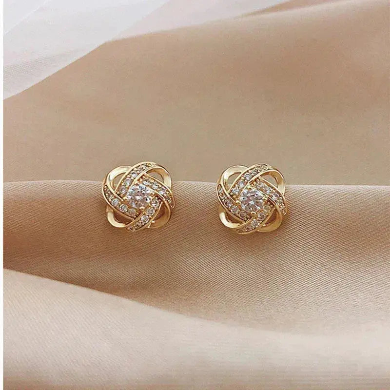 Gouden spiralen oorbellen met kristallen
